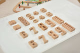 Set of wooden number blocks on a white surface