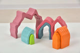 Colorful toy arches on a white surface