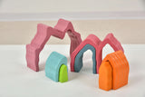 Colorful 3D-printed arches on a white surface