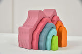Stack of colorful foam blocks on a white surface