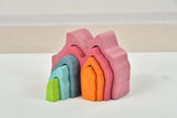 Stack of colorful building blocks on a white surface