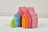 Colorful foam blocks stacked on a white surface
