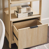 Wooden shelf with an open drawer containing books and decorative items.