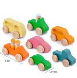 Set of colorful wooden toy cars with small figures on a white background