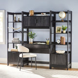 Black corner office desk with shelves and a chair against a light blue wall.