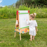 Child drawing on Tiny Land wooden art easel