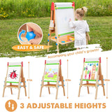 Child drawing on Tiny Land wooden art easel showing adjustable height for toddlers