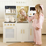 Children playing with play kitchen set